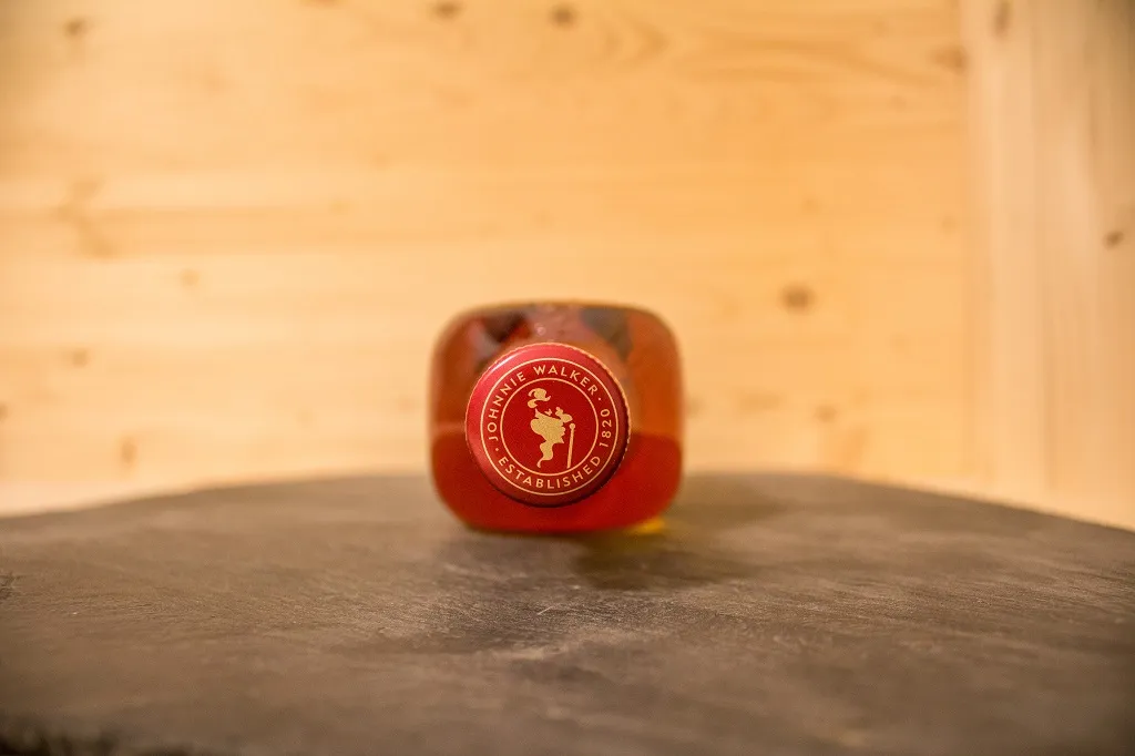 Auch auf dem Deckel vom Johnnie Walker Red Label, das Logo.
